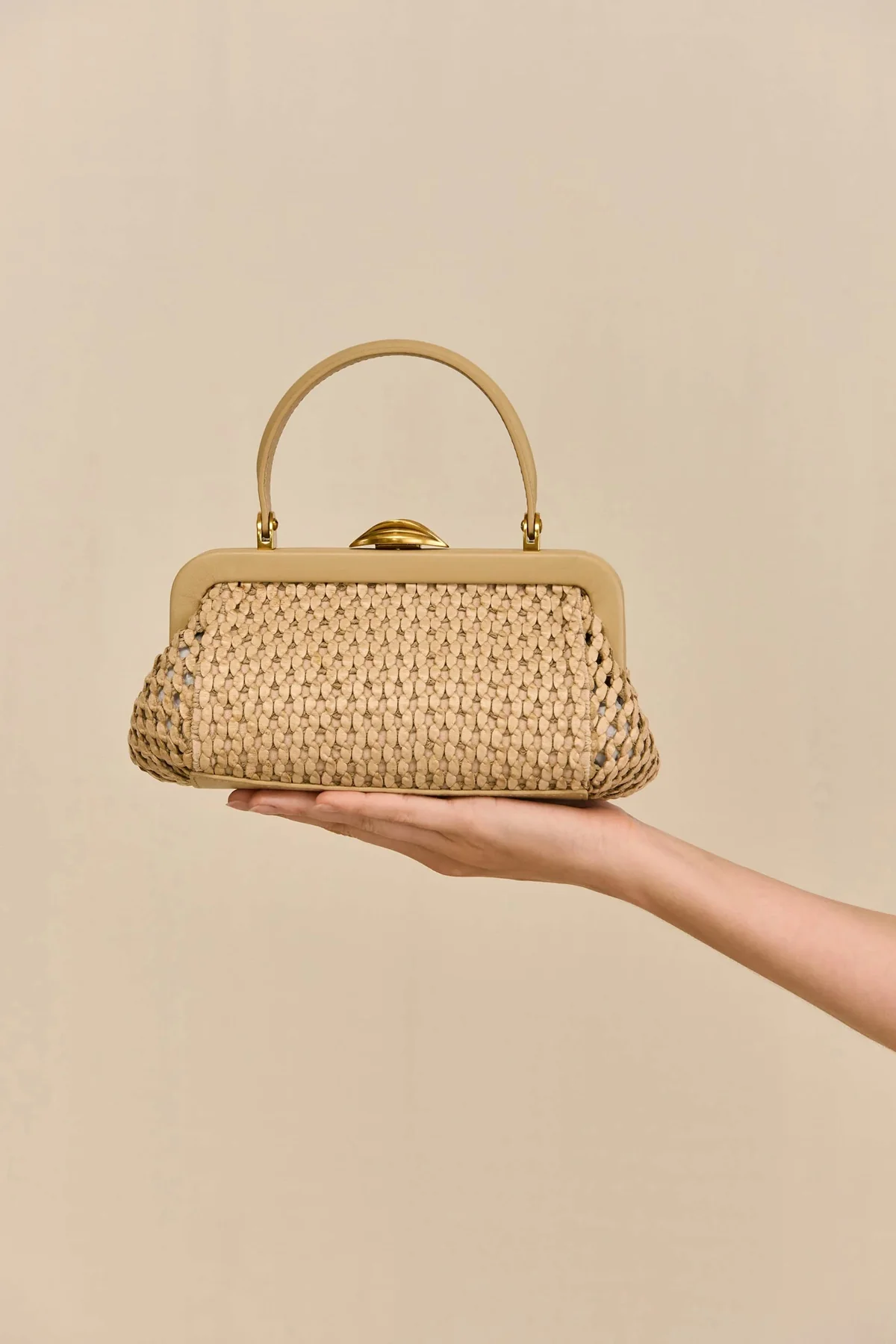 Cult Gaia Zuma Mini Bag in woven raffia.